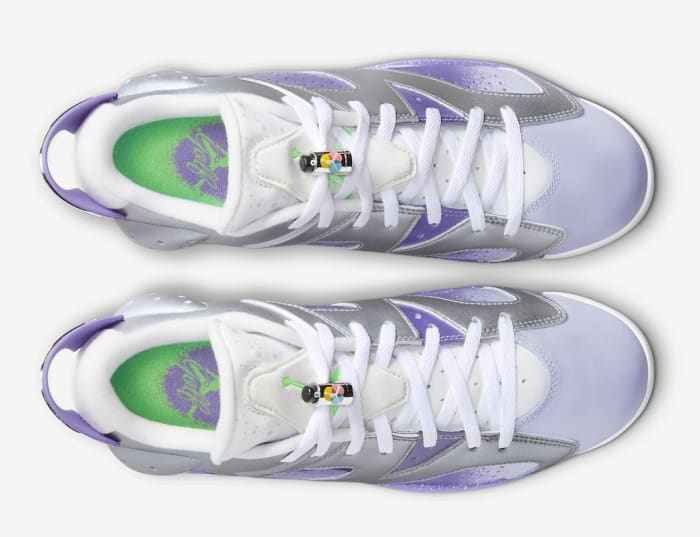 Overview of purple and grey Air Jordan golf shoes.